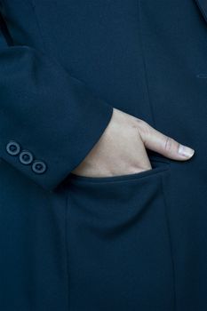 Close-up of leather Hands in her pockets