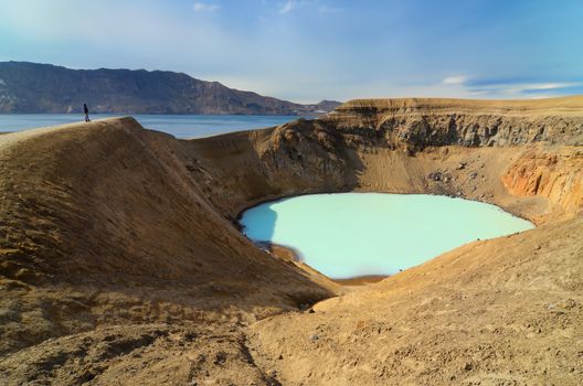 View of Viti volcano crater and person s silhouette, Askja, Iceland