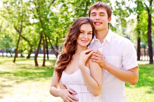 couple hugging in the park, have a good time together