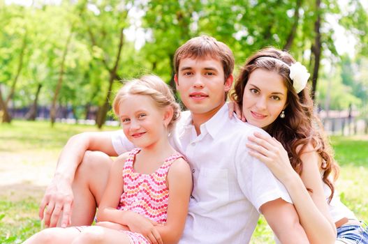 Family lying in the park, spend time with family