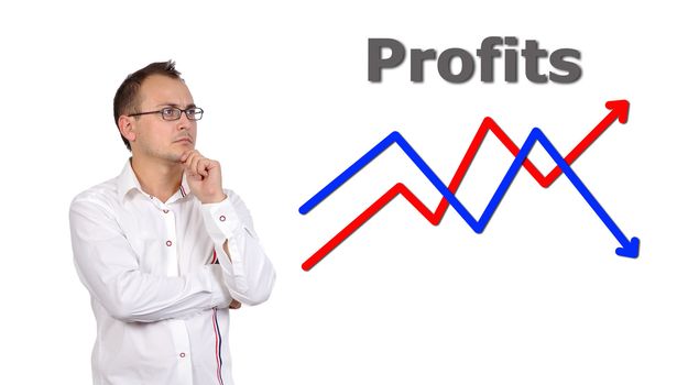 pensive businessman looking at growth chart profit