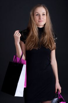 Happy girl with shopping studio photography