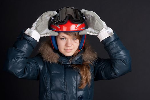 A girl in a ski helmet and goggles on your head