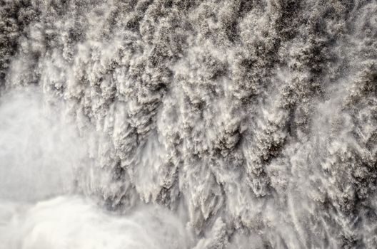 Detifoss waterfall detail of wild running water, Iceland