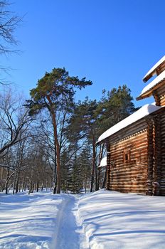 rural wooden house amongst snow