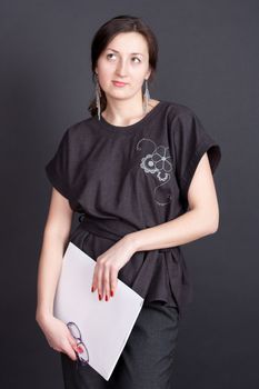 businesswoman with documents in the hands of studio shooting