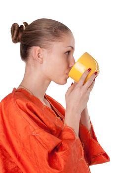 The girl in the orange robe drinking tea studio photography