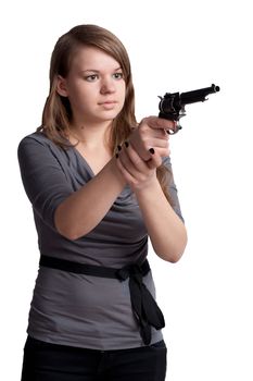 Girl with a gun in the hands of studio shooting