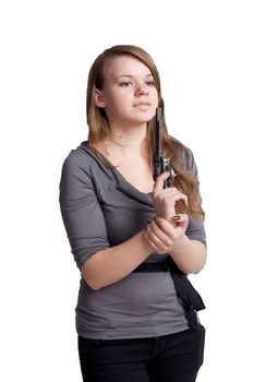 Girl with a gun in the hands of studio shooting