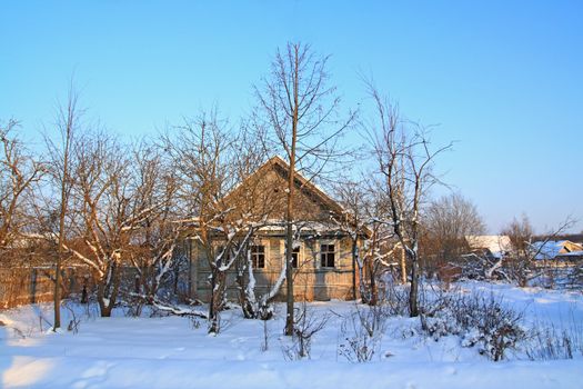 old rural house amongst snow
