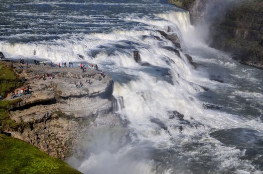 Gullfoss wild waterfall landscape, strong running water and people, Iceland