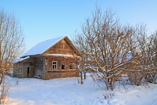 old rural house amongst snow