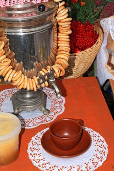 old-time samovar on red table