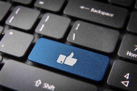Social media blue key with thumb up icon on laptop keyboard. Included clipping path, so you can easily edit it.