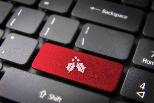 Red Christmas key with mistletoe icon on laptop keyboard. Included clipping path, so you can easily edit it.