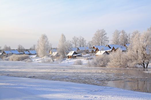 winter ice on river near villages