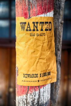 vintage wanted poster in a gost town