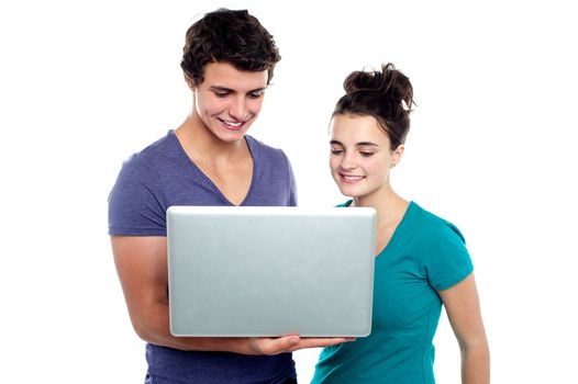Couple looking into the laptop isolated on white background