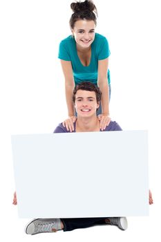 Teens advertising white blank billboard. Post your ad here