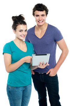 Technology savvy couple browsing newly launched tablet in market. Likely to buy it