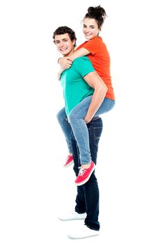 Portrait of loving couple enjoying together while piggyback ride