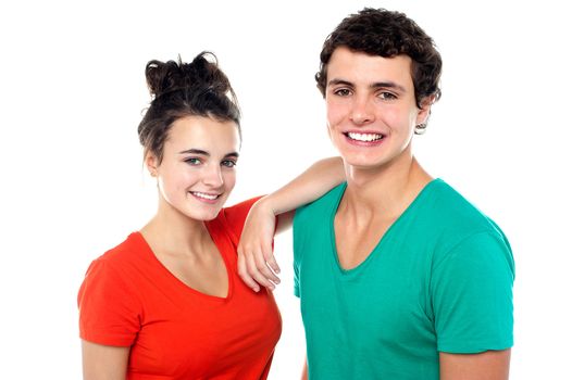 Young stylish teen couple in love. Looking at camera, closeup shot