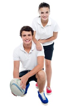 Charming football team players in sports attire isolated against white background