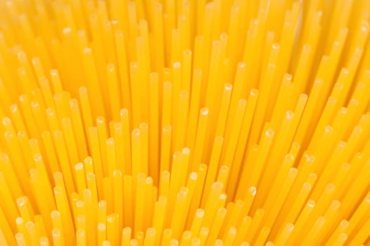 Close-up of long uncooked italian spaghetti background