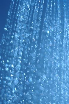 water drops falling from a shower indoors