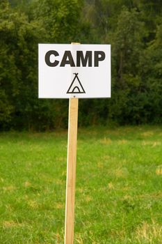 Camping sign on a field