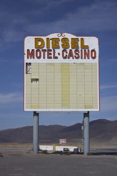 Vintage old gas diesel motel casino sign marquee in the middle of the desert