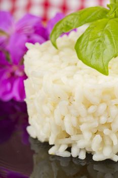 Round form of rice with basil and flower