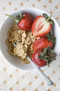 cereal bowl with strawberry put on white background