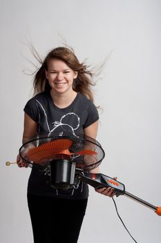 girl with a fan on a light background