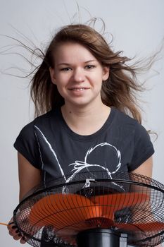 girl with a fan on a light background