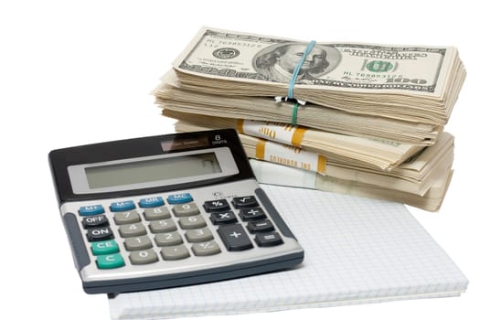 a bundle of money and a calculator on a white background