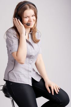 The girl in headphones with microphone