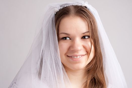 Pretty girl with a veil on her head