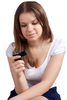 Girl with a cigarette lighter in the hands of studio shooting