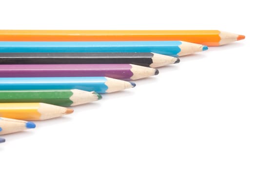 crayons are cascaded on a white background