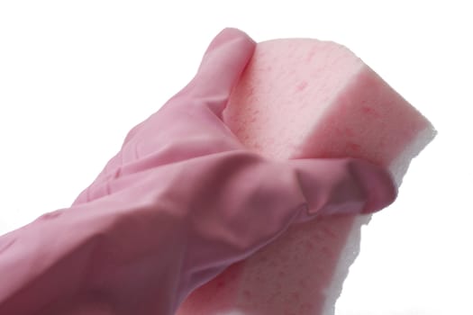 Hand in a pink rubber glove holding a pink sponge