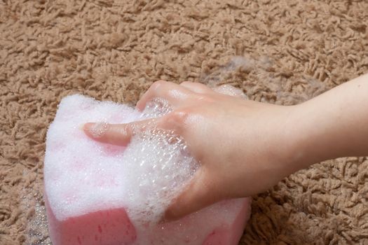 Pink wool carpet cleaned with foam