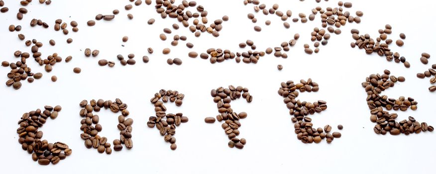 The inscription "coffee" coffee beans on white background