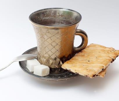 A cup of coffee and biscuits