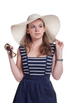 A girl in a straw hat, studio shot