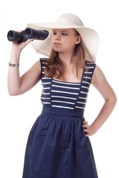 A girl in a big straw hat looking through binoculars on a white background