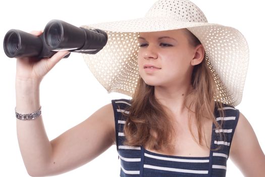 A girl in a big straw hat looking through binoculars on a white background