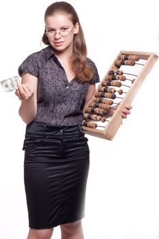 Girl with big wooden accounts and money on a white background