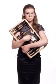 Girl with big wooden accounts and money on a white background