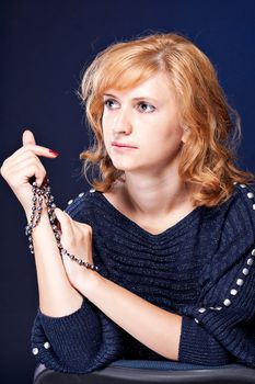 Beautiful girl with tied hands studio photography